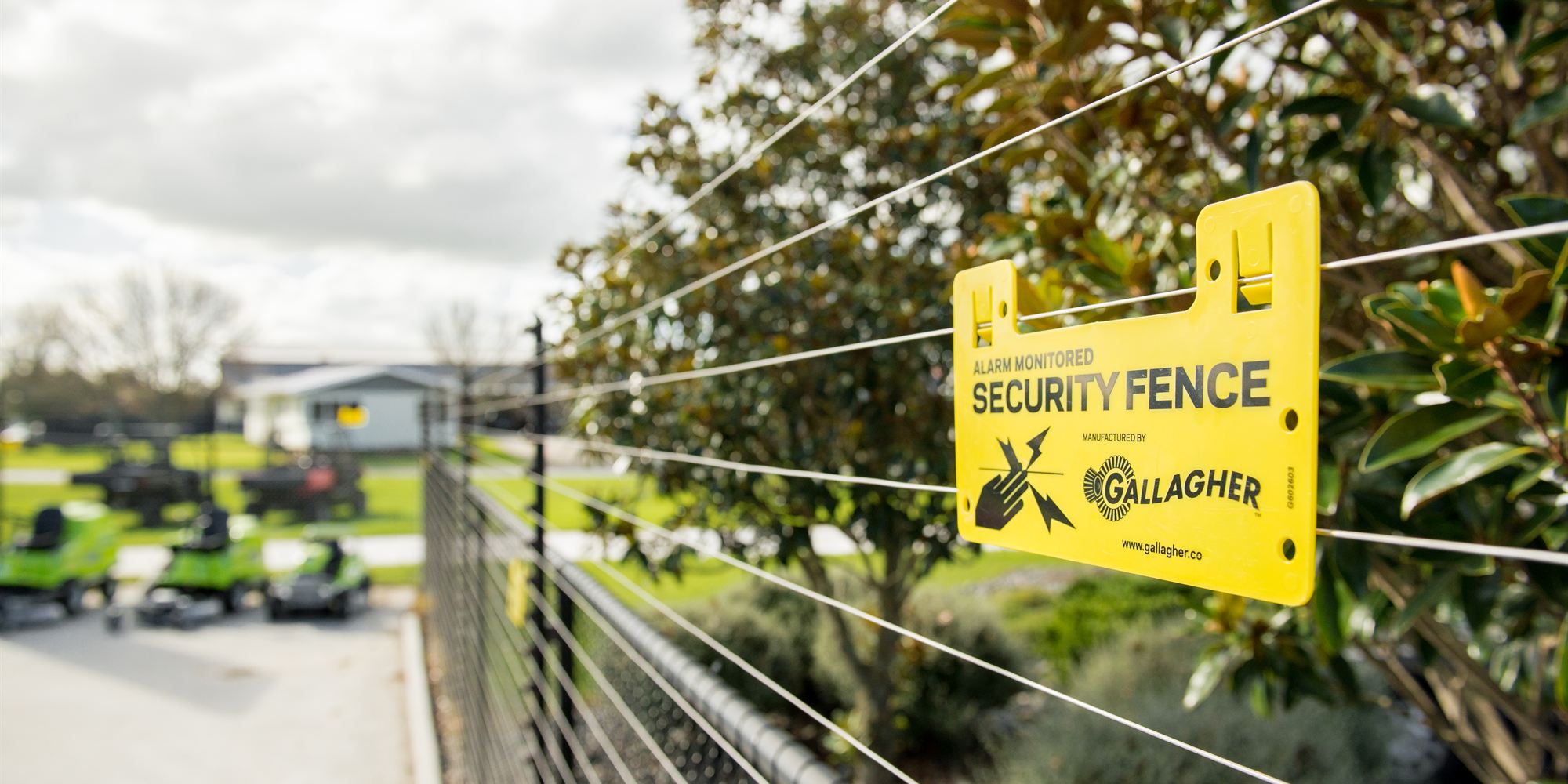An alarm-monitored Gallagher security fence protecting a commercial yard